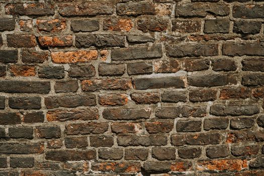 Ancient bricks wall, paving stones in medieval european city. Texture, background. High quality photo