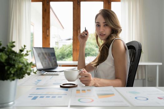 Business owner has online meeting with international partners