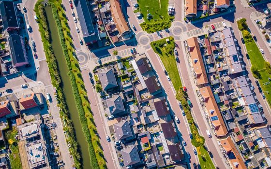 Dutch Suburban area with modern family houses, newly build modern family homes in the Netherlands, dutch family houses in the Netherlands, newly build streets with modern houses.