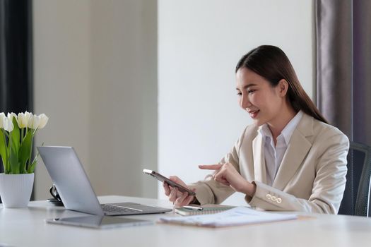 Fund investment concept. Business woman using finance application on cell phone.