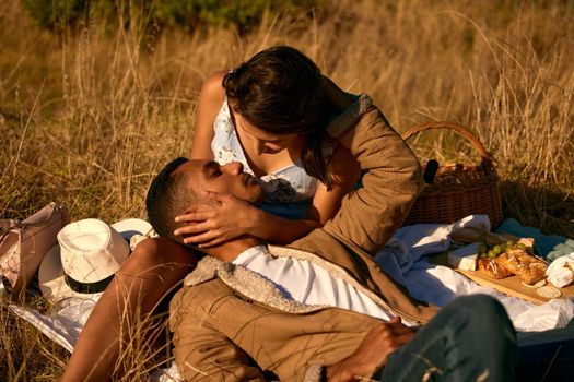 Can I get a kiss. a young couple on a romantic date outside in nature