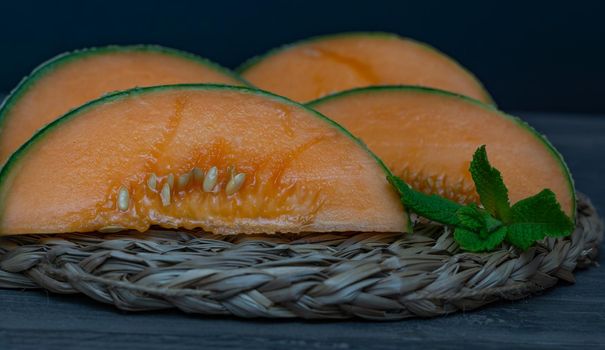 cantaloupe melon on black background dark food