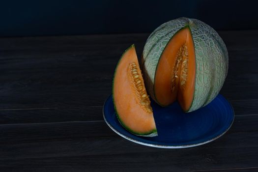 cantaloupe melon on black background dark food