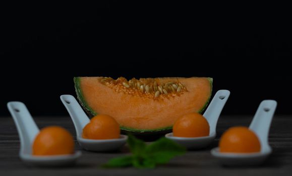 cantaloupe melon on black background dark food