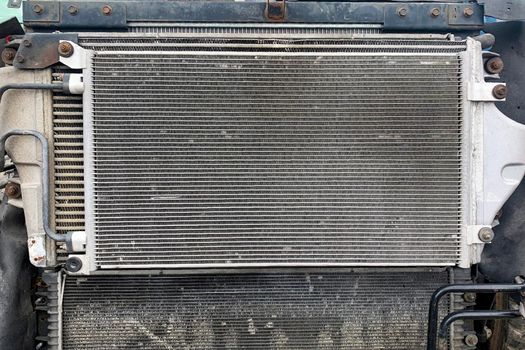 Closeup of scrap metal, used car radiators in a scrap yard, used car radiator for recycling in a car dump.