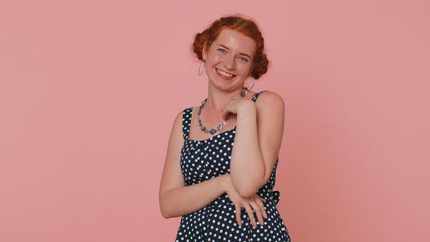 Happy young woman laughing out loud after hearing ridiculous anecdote, funny joke, feeling carefree amused, positive people lifestyle. Ginger freckles girl isolated alone on pink studio background
