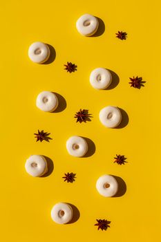 french and spanish speciality rousquilles anise flavor desserts on the yellow background, pattern, hard light, top view