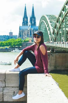 Cologne Koln Germany during sunset, Cologne bridge with the cathedral. beautiful sunset at the Rhine river, happy Asian women visiting Cologne