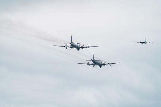 Russia, St. Petersburg, 28 July 2022: Military aircraft and helicopters of the air force fly on the city at the celebration of the Day of the Navy, amphibious and transport aircraft, anti-submarine. High quality photo