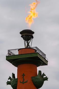 The fire of memory is lit on the rostral columns in St. Petersburg at the celebration of the day of the Russian Navy. High quality photo