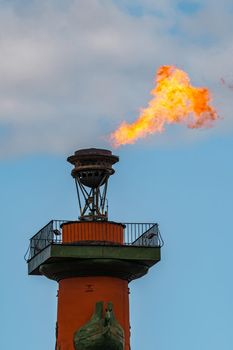 The fire of memory is lit on the rostral columns in St. Petersburg at the celebration of the day of the Russian Navy. High quality photo