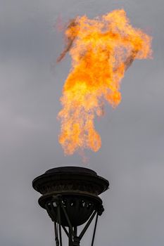 The fire of memory is lit on the rostral columns in St. Petersburg at the celebration of the day of the Russian Navy. High quality photo