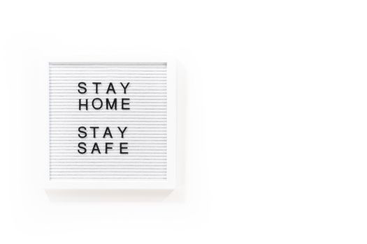 STAY HOME and STAY SAFE sign on message board.