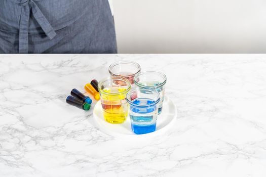 Coloring hard-boiled white eggs with natural food coloring.