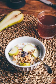 Close-up of Bowl with Delicious Granola and Fresh Pear
