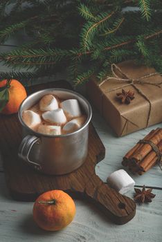 Christmas hot chocolate with marshmallows on cutting board