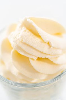 Homemade whipped cream in a class ice cream bowl.