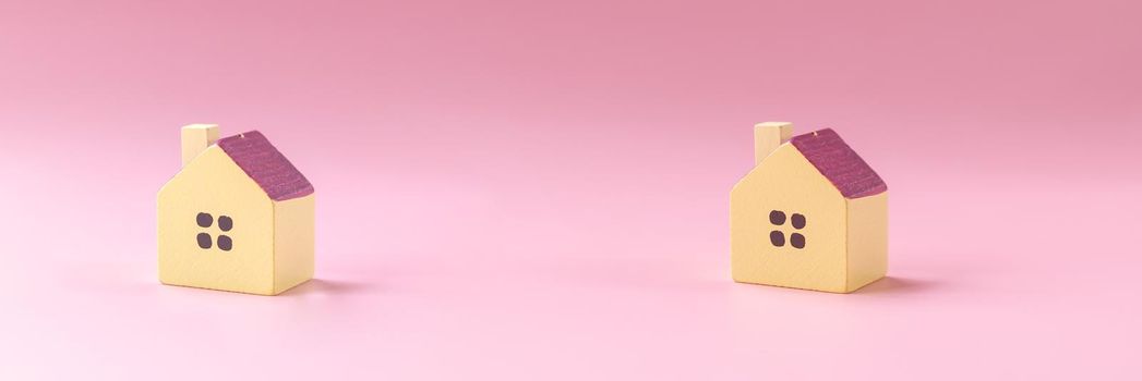 Simply minimal design with miniature toy house isolated on white background. Mortgage property insurance dream home concept.