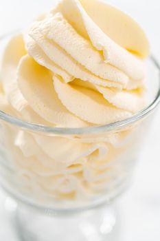 Homemade whipped cream in a class ice cream bowl.