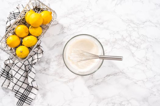 Mixing ingredients into the batter for lemon pound cake.