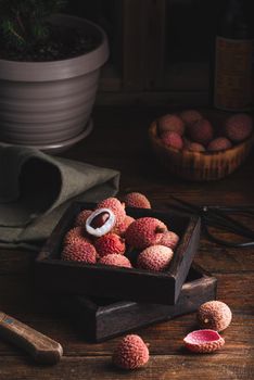 Delicious Lychee Fruits in Rustic Wooden Box