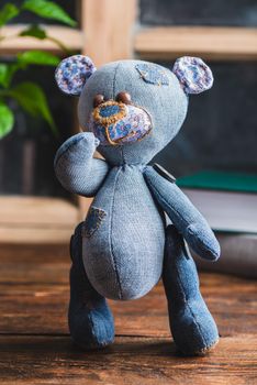 Handmade Stuffed Bear Toy Standing on Wooden Table