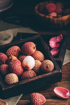 Small Box of Lychees on Wooden Table