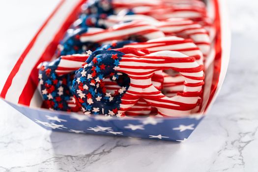 American flag. Red, white, and blue chocolate-covered pretzel twists.