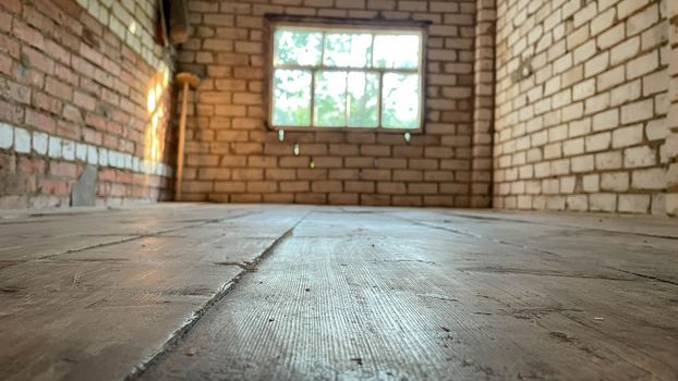 Empty, loft industrial grunge interior. Old brick walls and big windows. Interior concept background.