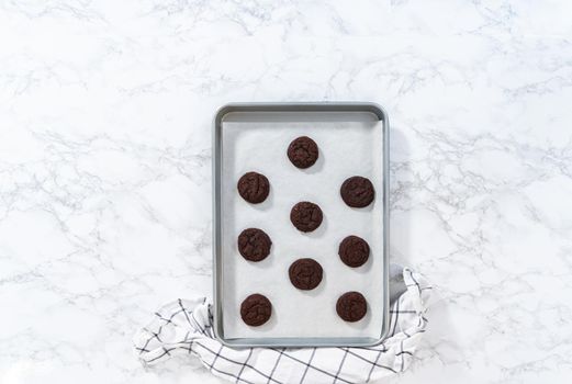 Flat lay. Cooling freshly baked chocolate cookies on a kitchen counter.