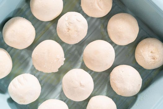 Baking dinner rolls from the premade frozen dough in the baking pan.