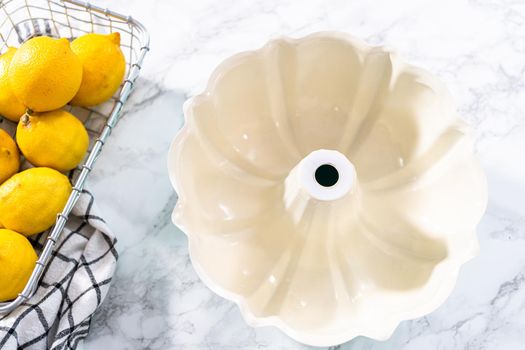 Empty baking pan prepared to bake a lemon pound cake.