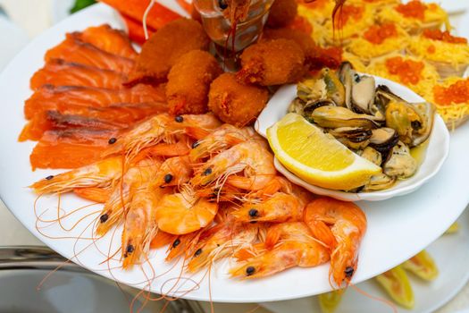 Red fish and boiled crayfish as an appetizer for beer.