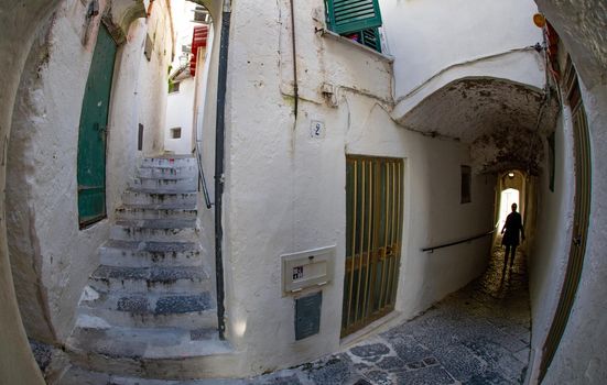 Narrow streets with many stairs going up and down in Positano Italy