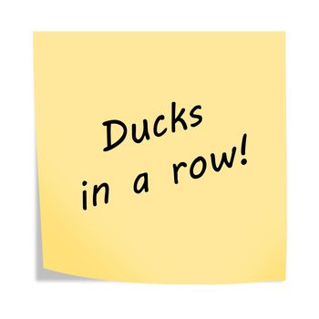 A Ducks in a row 3d illustration post note reminder on white with clipping path