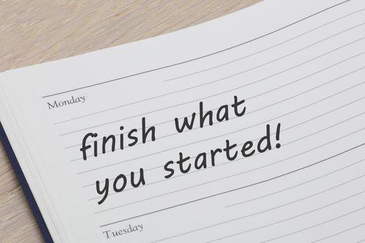 A finish what you started diary reminder appointment open on desk