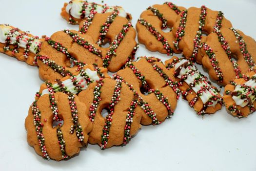 Crispy Christmas Cookies decorated with chocolate and sprinkles