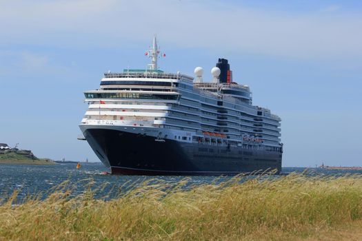 IJmuiden, The Netherlands - June 5th 2017: Queen Victoria, Cunard on North Sea Channel towards North Sea Lock in IJmuiden