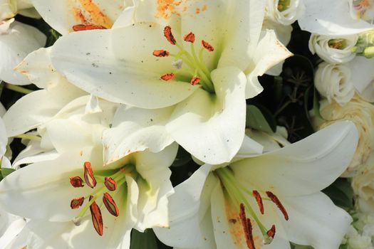 Big white lilies in a floral wedding decoration
