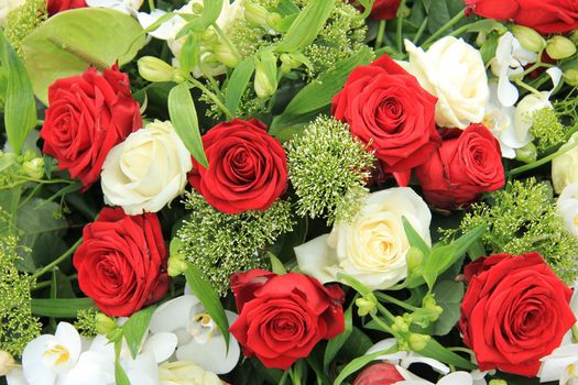 Big red and white roses in a floral wedding decoration