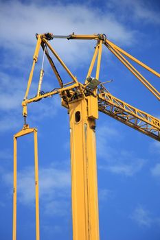 Tall construction crane at a construction site