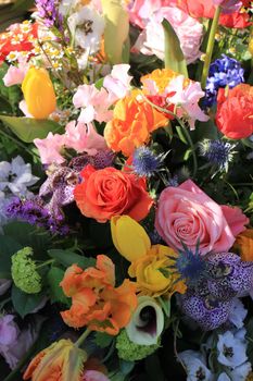 Mixed flower arrangement: various flowers in different colors for a wedding