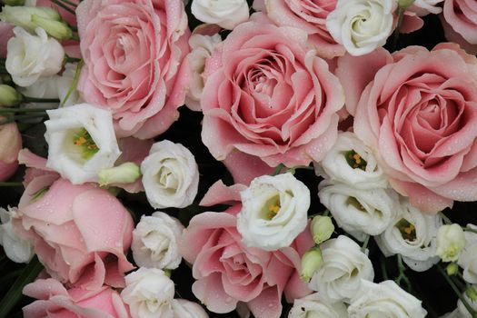 Pink and white  flowers in a floral wedding decoration