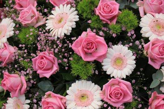 Pink roses and gerberas in a wedding arrangement