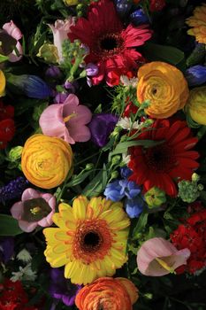 Mixed flower arrangement: various flowers in different colors for a wedding