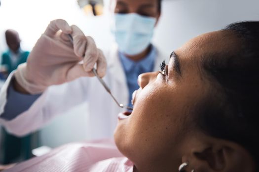 I can tell youve been taking care of your teeth. a young woman having dental work done on her teeth