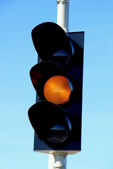 Traffic lights in a clear blue sky