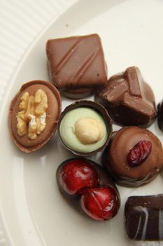 Delicious chocolates from Belgium, decorated with nuts and fruits