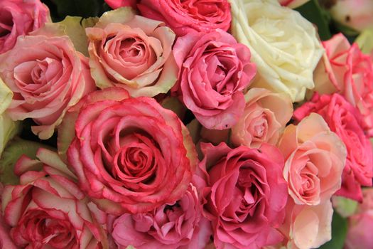 Roses in various shades of pink, wedding decorations