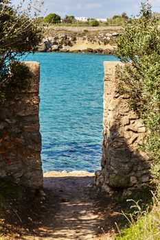 Navy blue sea and clear sky. Breathtaking natural landscapes. Fantastic beach of fine white sand, Puglia, Italy. Tourism, travel concept.